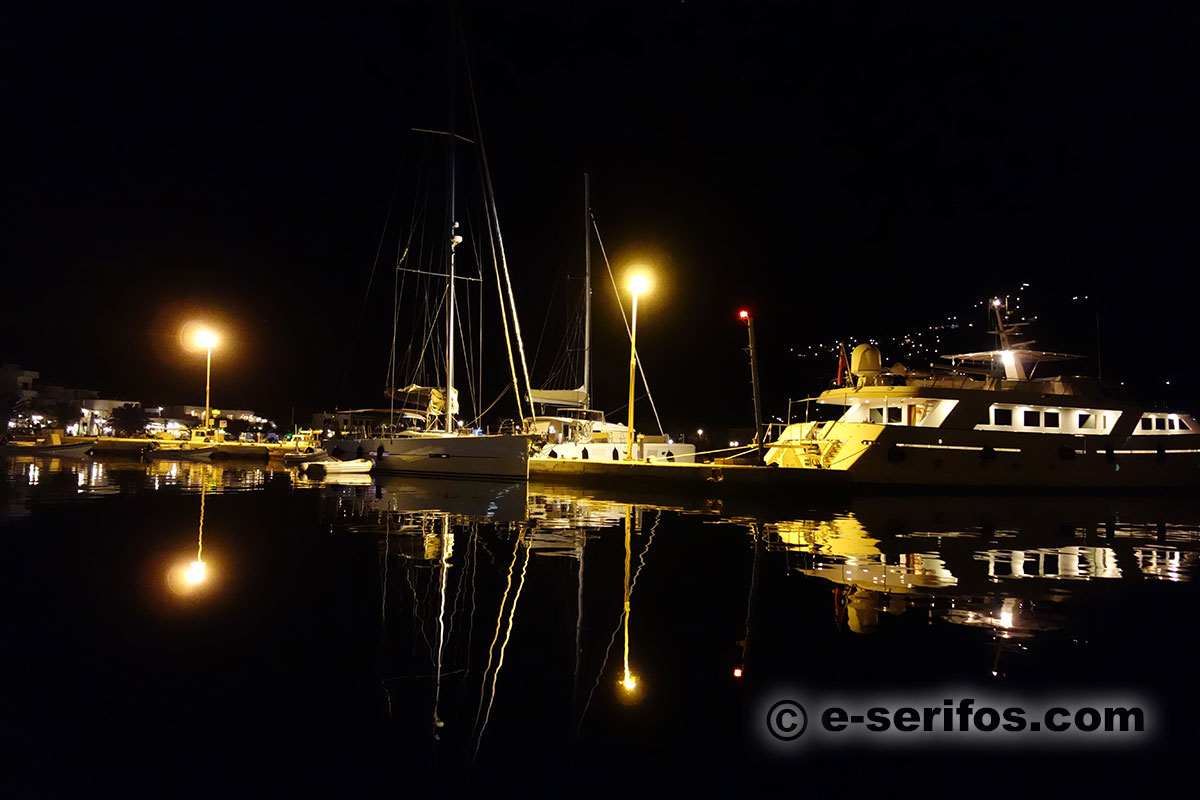 Sailboats and luxury yachts in the marina of Serifos